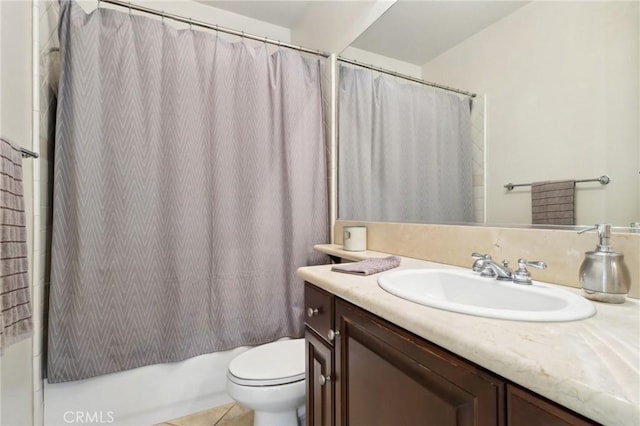 full bathroom featuring toilet, tile patterned flooring, shower / tub combo with curtain, and vanity