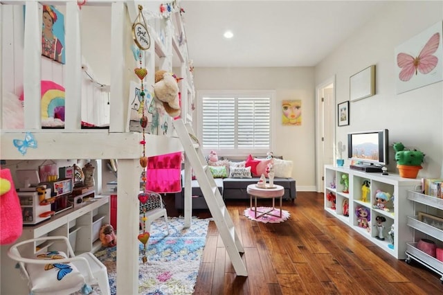 game room with hardwood / wood-style floors and recessed lighting