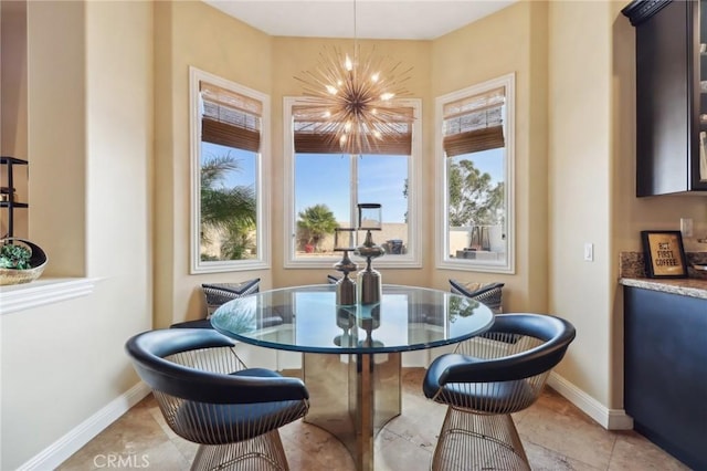 dining area featuring an inviting chandelier