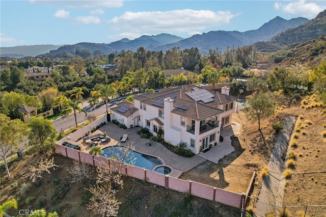 birds eye view of property with a mountain view