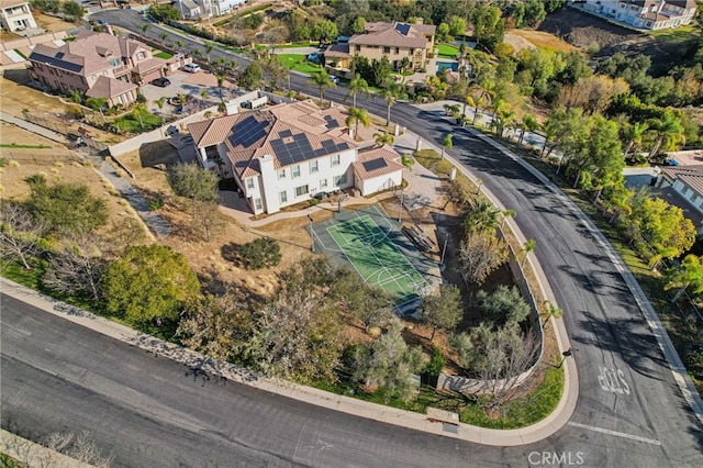 birds eye view of property with a residential view