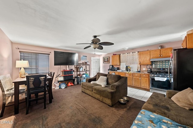 tiled living room with ceiling fan