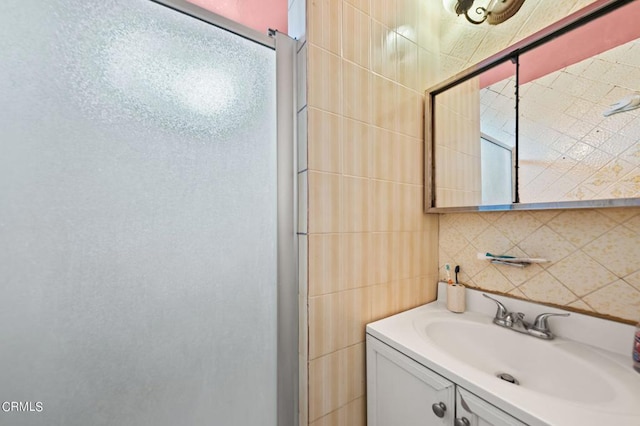 bathroom with decorative backsplash and vanity