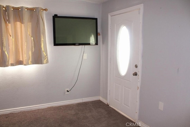 foyer with carpet flooring