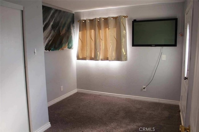 unfurnished room featuring carpet flooring