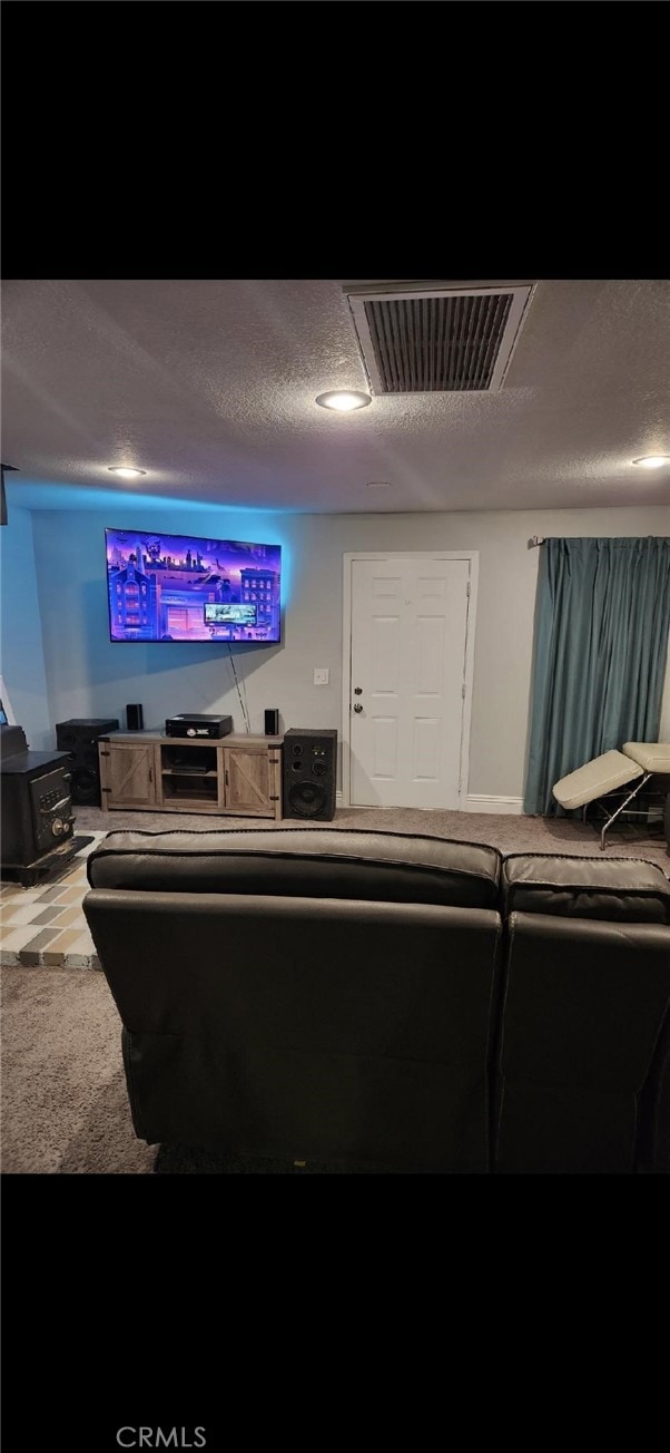 cinema room featuring a textured ceiling