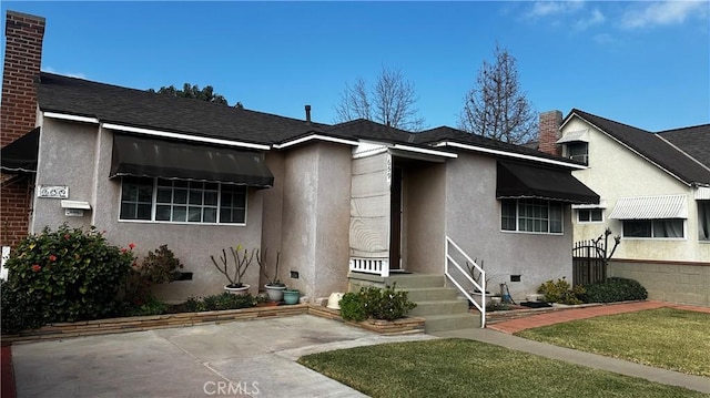 view of front of house with a patio