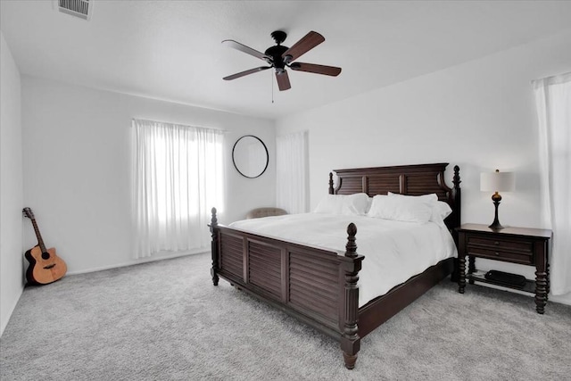 bedroom with ceiling fan and light colored carpet