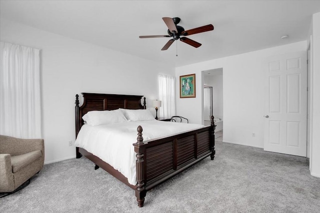 bedroom with ceiling fan and light colored carpet