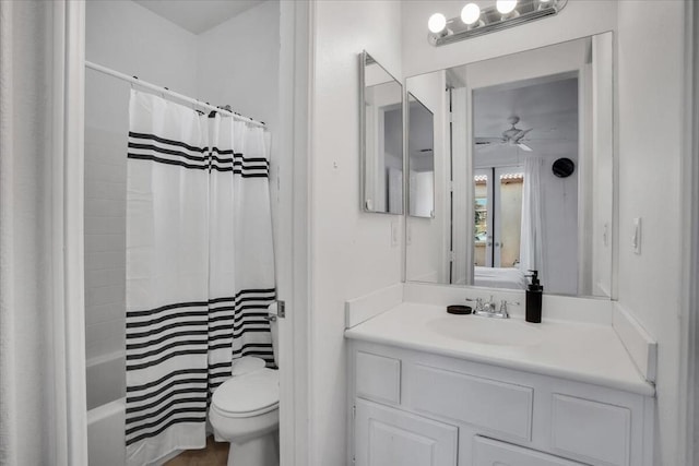 full bathroom with toilet, vanity, ceiling fan, and shower / bath combo with shower curtain