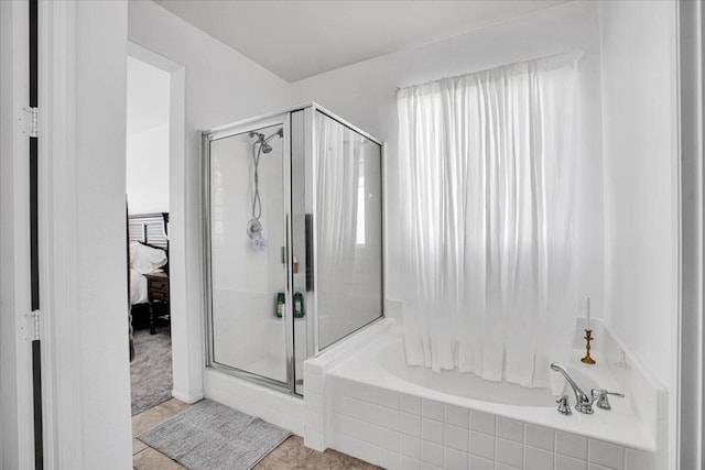 bathroom featuring plus walk in shower and tile patterned floors