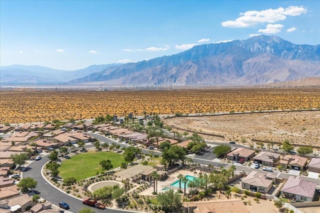 birds eye view of property with a mountain view