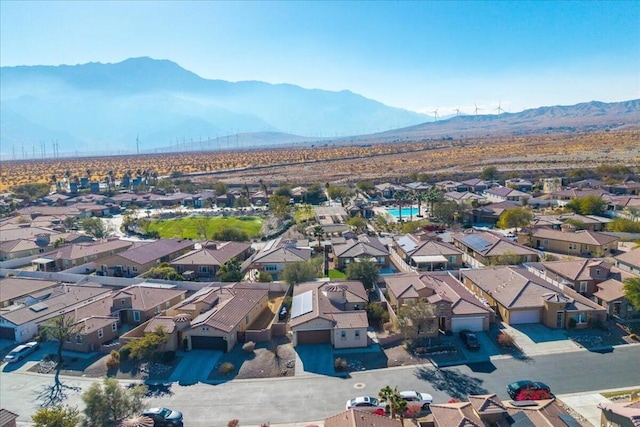 birds eye view of property with a mountain view