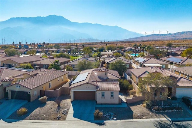 birds eye view of property with a mountain view