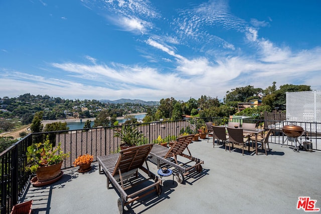 view of patio featuring a water view