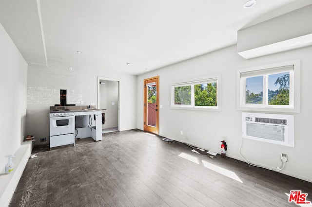 living room with dark wood-type flooring and a wall mounted air conditioner