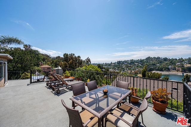 view of patio / terrace featuring a water view