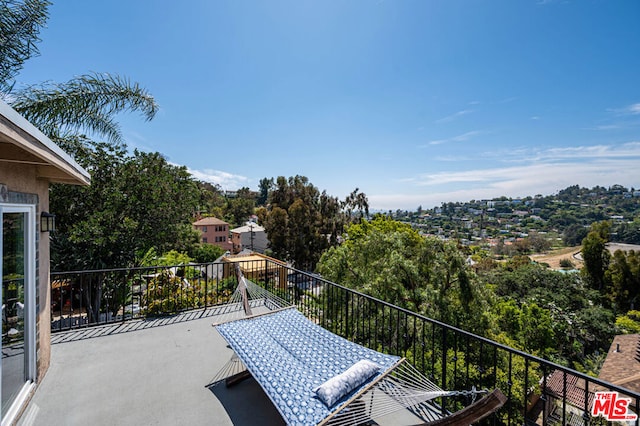 view of patio featuring a balcony