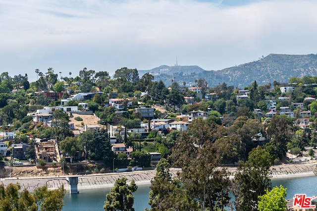 bird's eye view with a water and mountain view