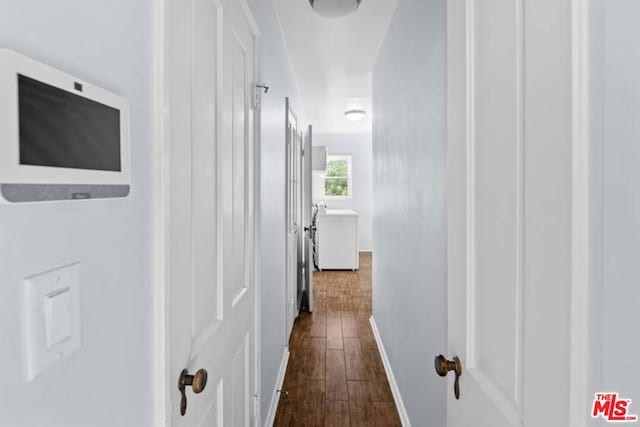 hall with dark wood-type flooring