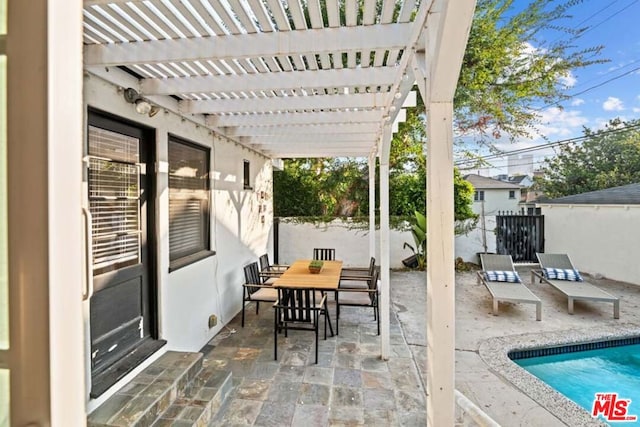 view of patio featuring a pergola and a fenced in pool