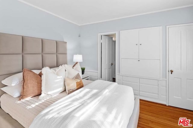 bedroom with light hardwood / wood-style flooring