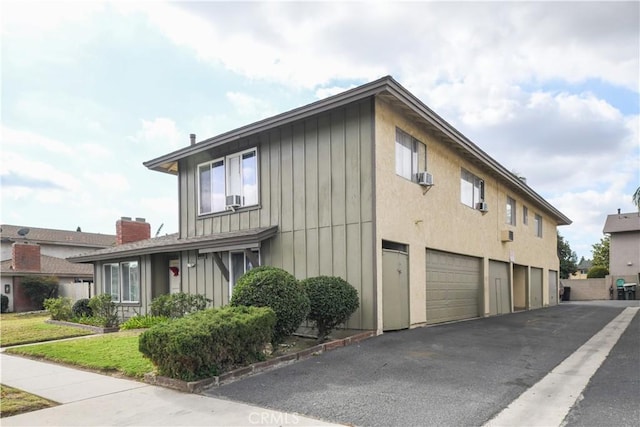 view of property exterior with a garage