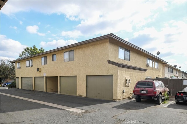 view of side of property with a garage