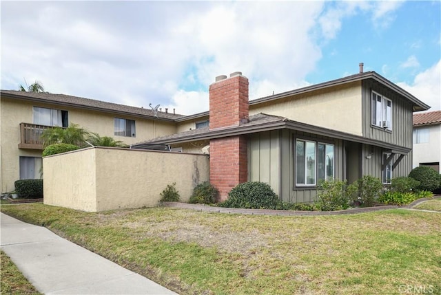 view of side of home featuring a lawn