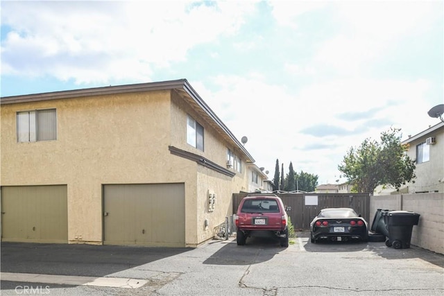 view of side of home with a garage