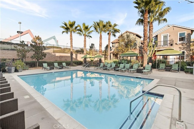 view of swimming pool with a patio