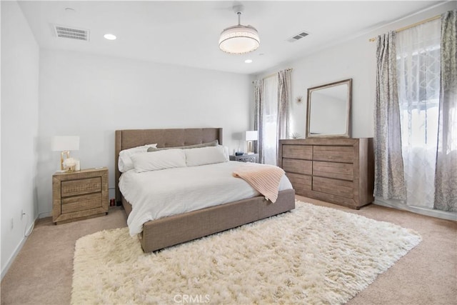 bedroom featuring light colored carpet