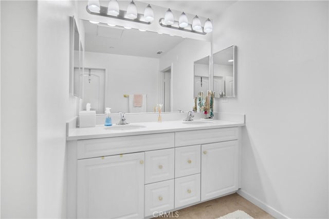 bathroom with vanity and tile patterned flooring