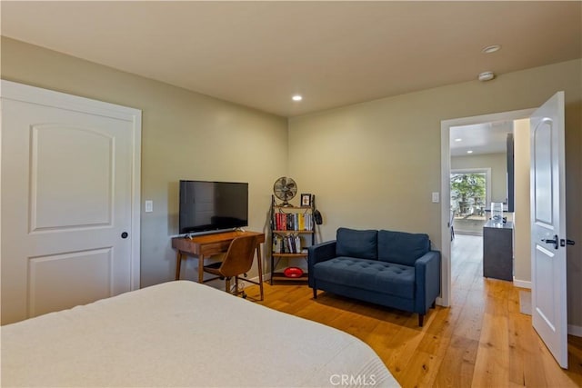 bedroom with hardwood / wood-style flooring