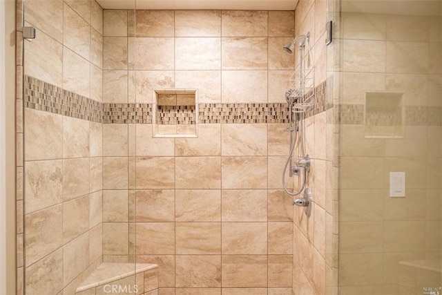 bathroom featuring tiled shower