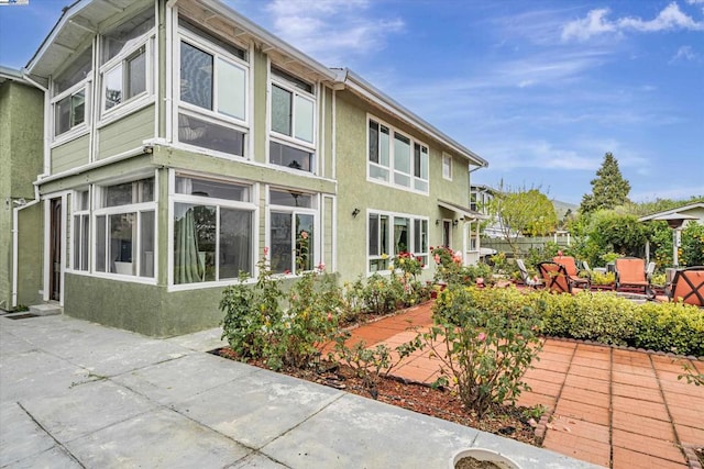 view of home's exterior with a patio area