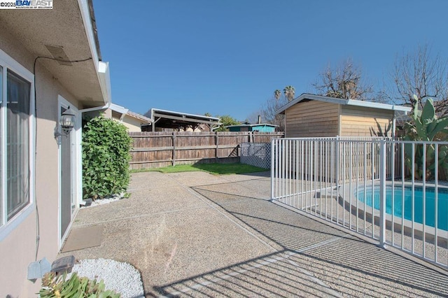 view of patio featuring a fenced in pool