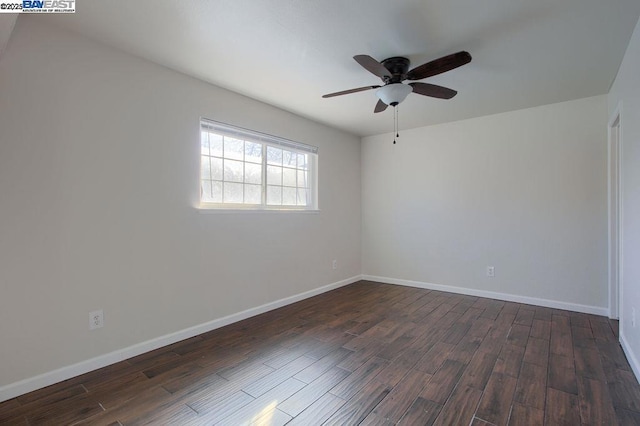 spare room featuring ceiling fan and dark hardwood / wood-style flooring