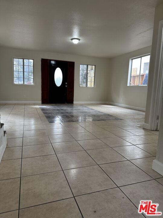 entrance foyer featuring light tile patterned floors