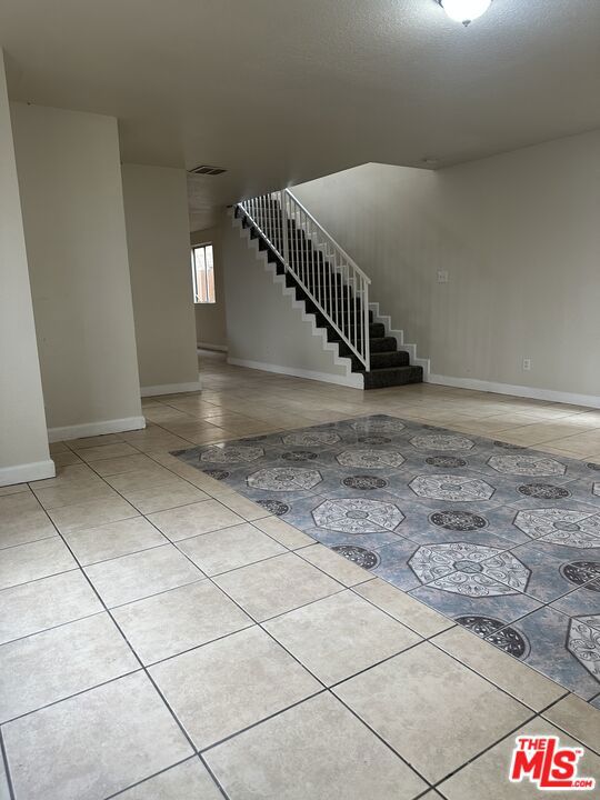 interior space with light tile patterned floors