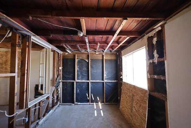 basement featuring wooden ceiling