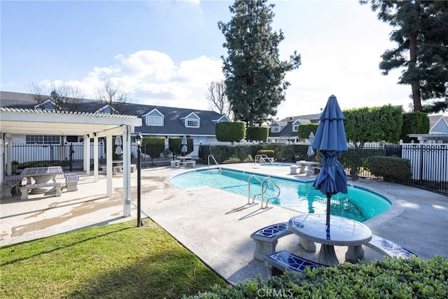 view of swimming pool with a patio and a pergola