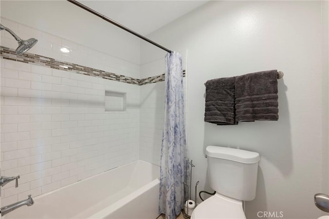 bathroom featuring toilet and shower / tub combo with curtain