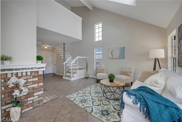 tiled living room featuring high vaulted ceiling