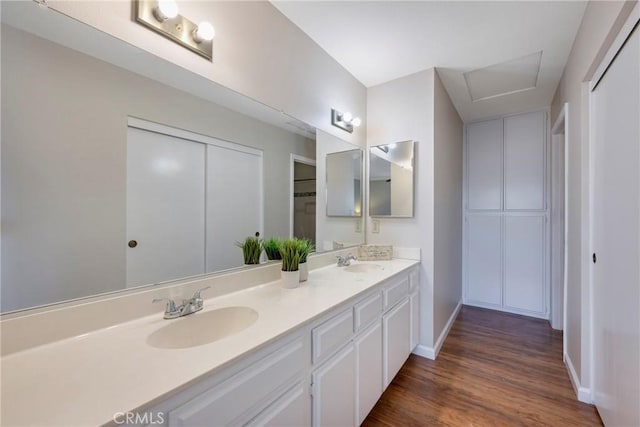 bathroom with hardwood / wood-style flooring and vanity