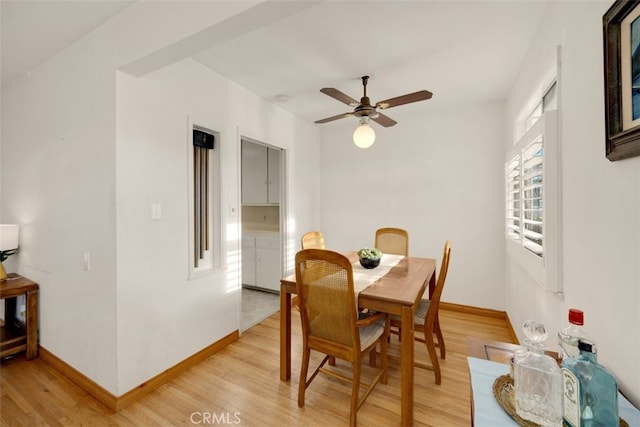 dining area featuring light hardwood / wood-style flooring and ceiling fan