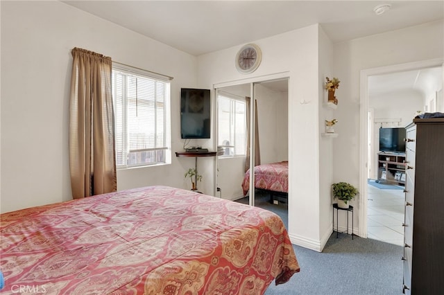 carpeted bedroom with a closet