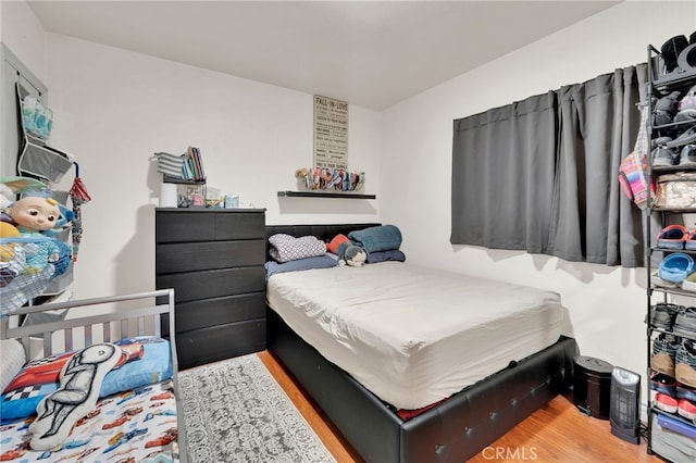 bedroom featuring light hardwood / wood-style floors