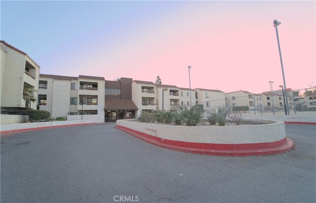 view of outdoor building at dusk