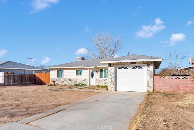 ranch-style home featuring a garage